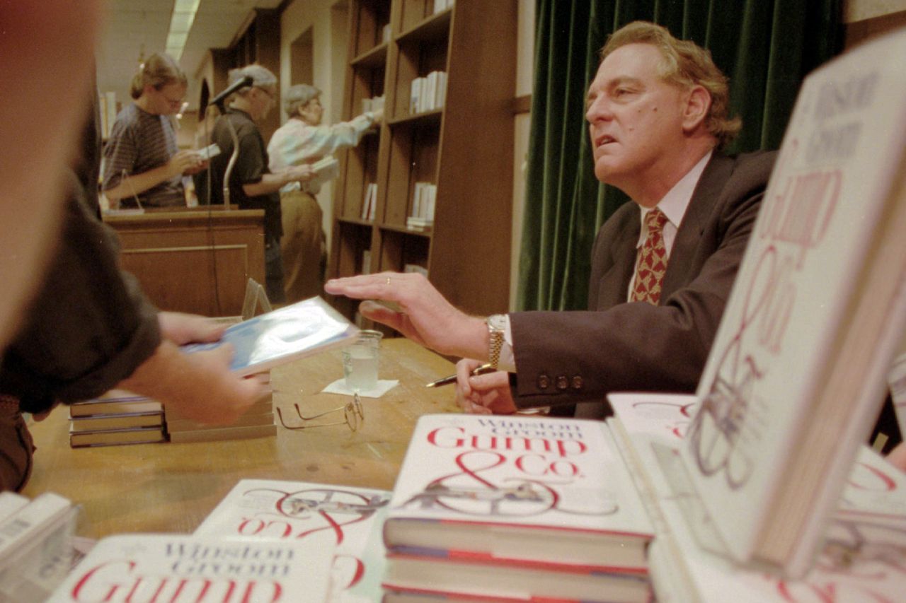 In this Aug. 21, 1995, file photo, Winston Groom, author of &amp;quot;Forrest Gump,&amp;quot; the book on which the film was based, signs copies of &amp;quot;Gump &amp;amp; Co.,&amp;quot; the sequel to &amp;quot;Forrest Gump&amp;quot;, at a New York Cit