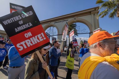 People picket outside of Paramount Pictures on the first day of the Hollywood writers strike on May 2, 2023 in Los Angeles.