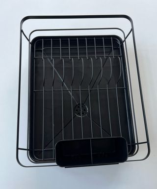 An empty black dish rack