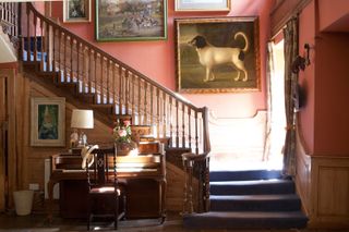 hallway with art and piano