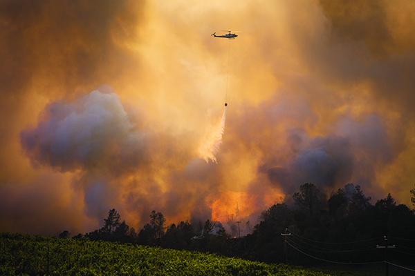 A-helicopter-fights-a-wildfire-near-vineyards-in-Napa-County-in-2020.-Credit-Philip-Pacheco-Bloomberg-Getty-Images.jpg