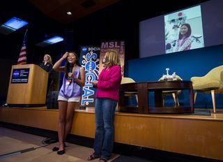 Fifteen-year-old Clara Ma reads the essay she wrote at age 12 to win a contest to name NASA's Mars Science Laboratory mission. She named the rover Curiosity.