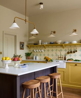 Kitchen design by Uns Hobbs featuring layered ceiling and wall lighting