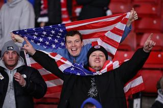 GLASGOW, SCOTLAND - NOVEMBER 18: Fans of Scotland celebrate with USA flags after qualifying for the FIFA World Cup USA 2026 (Photo by Robbie Jay Barratt - AMA/Getty Images)