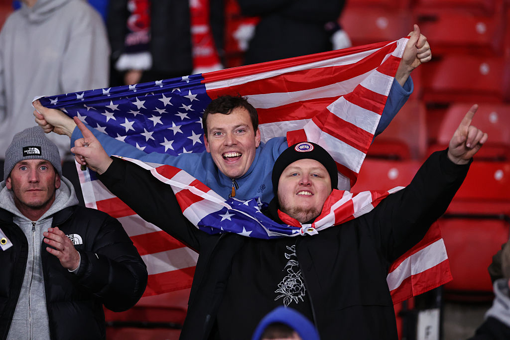 GLASGOW, SCOTLAND - NOVEMBER 18: Fans of Scotland celebrate with USA flags after qualifying for the FIFA World Cup USA 2026  (Photo by Robbie Jay Barratt - AMA/Getty Images)