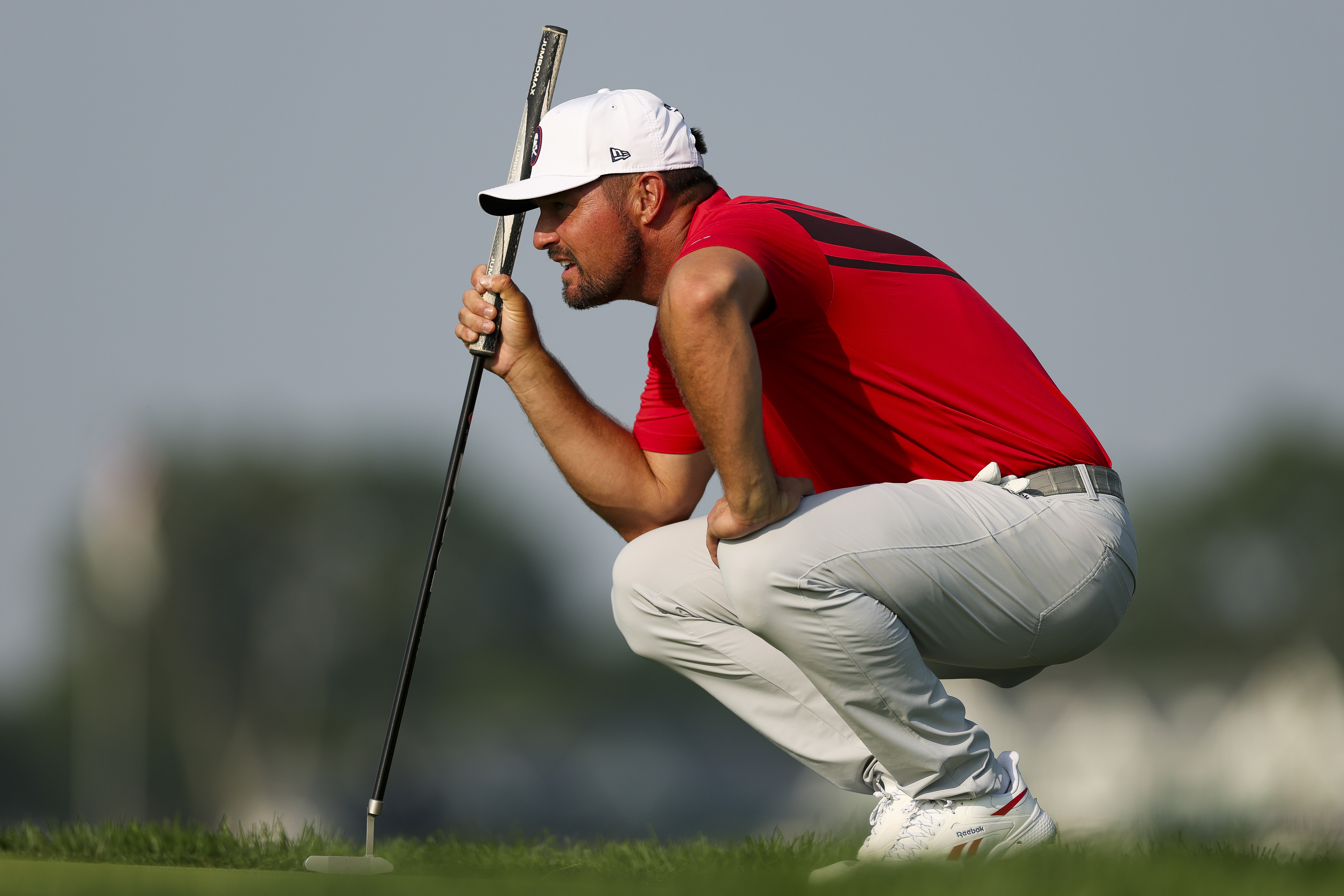 Bryson DeChambeau lines up a putt