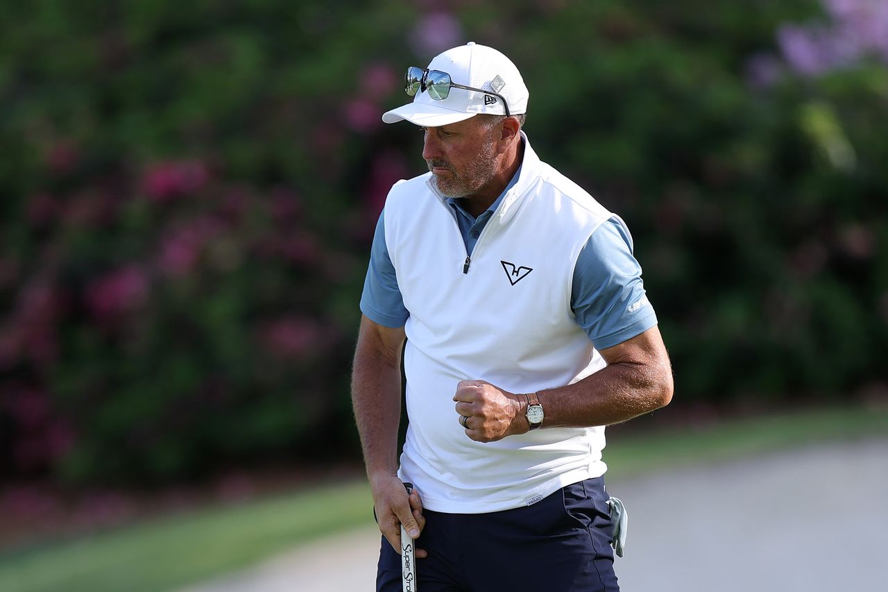 Phil Mickelson fist pumps after a putt