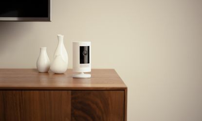Ring security camera on wooden sideboard