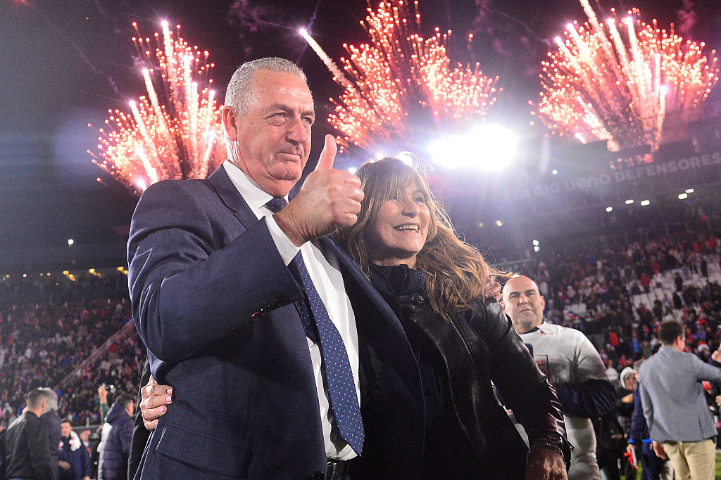 Paraguay&#039;s Argentine head coach Gustavo Alfaro (R) gives a thumbs up with his wife Daniela Pignolo (R) as they celebrate after the 2026 FIFA World Cup South American qualifiers football match between Paraguay and Ecuador at the Defensores del Chaco stadium in Asuncion on September 4, 2025.