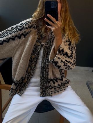 Angie wears a soft cardigan from Free People