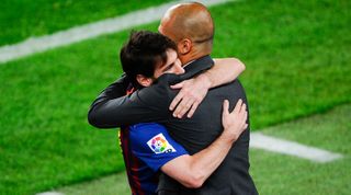 Lionel Messi and Pep Guardiola embrace during their time together at Barcelona