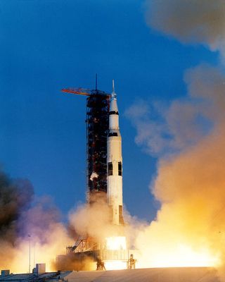 Apollo 13 mission launches on top of Saturn V rocket.
