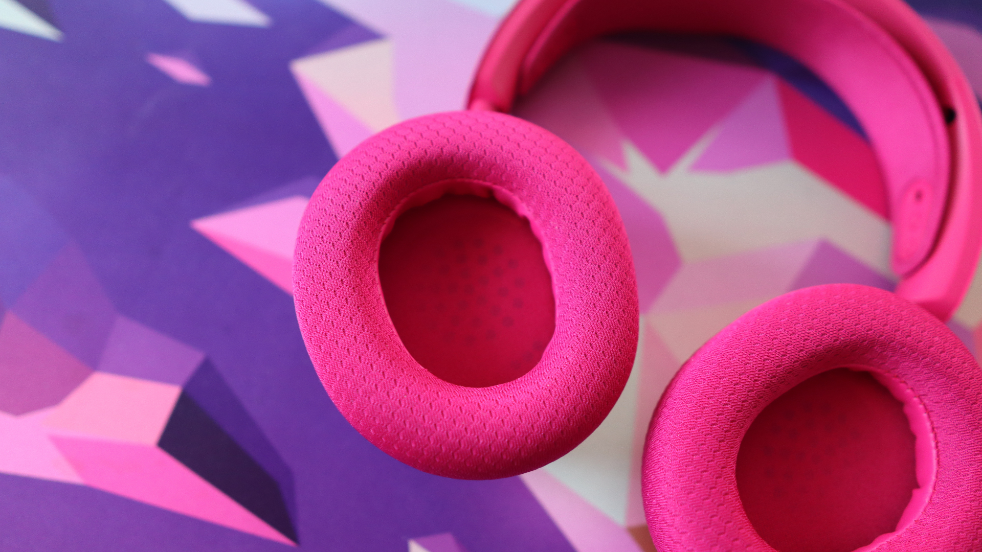 SteelSeries Arctis Nova 7X Wireless Gen 2 in pink on a mouse pad.