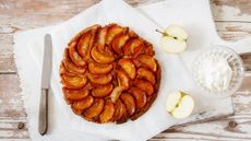 An apple tarte tatin on a wooden table