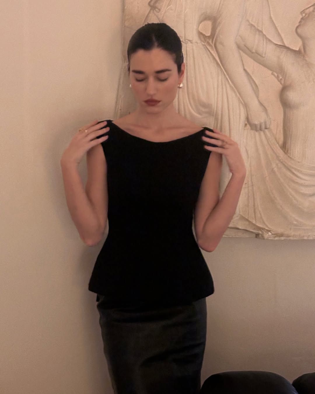 @iliridakrasniqi wearing a black dress