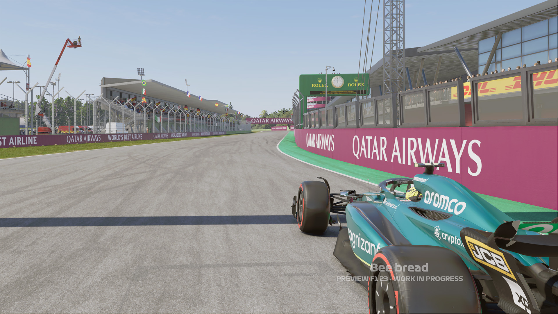 An in-game screenshot of an Aston Martin F1 car at the Imola circuit in F1 23.
