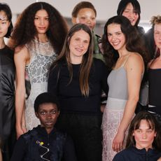 Cecilie Bahnsen stands with models at her Paris Fashion Week show