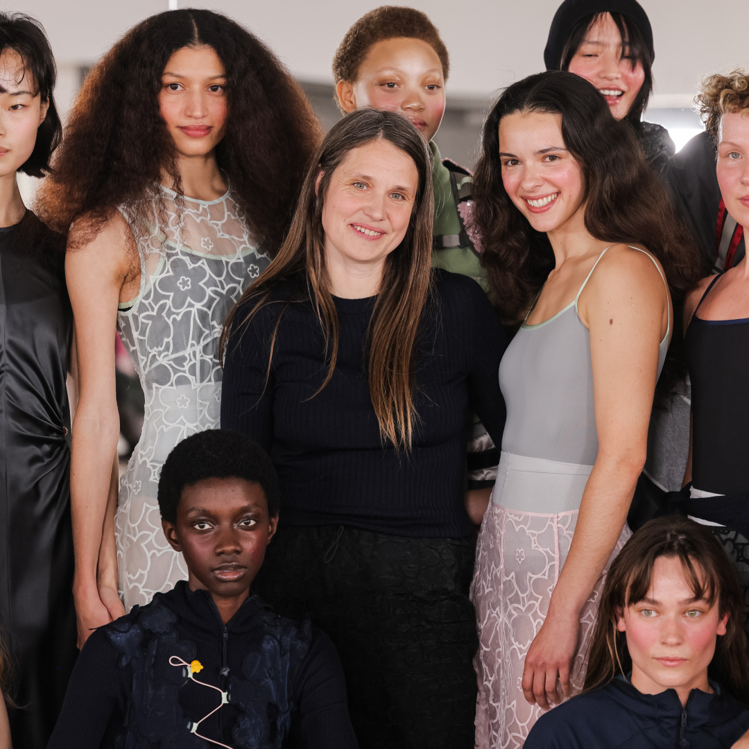Cecilie Bahnsen stands with models at her Paris Fashion Week show