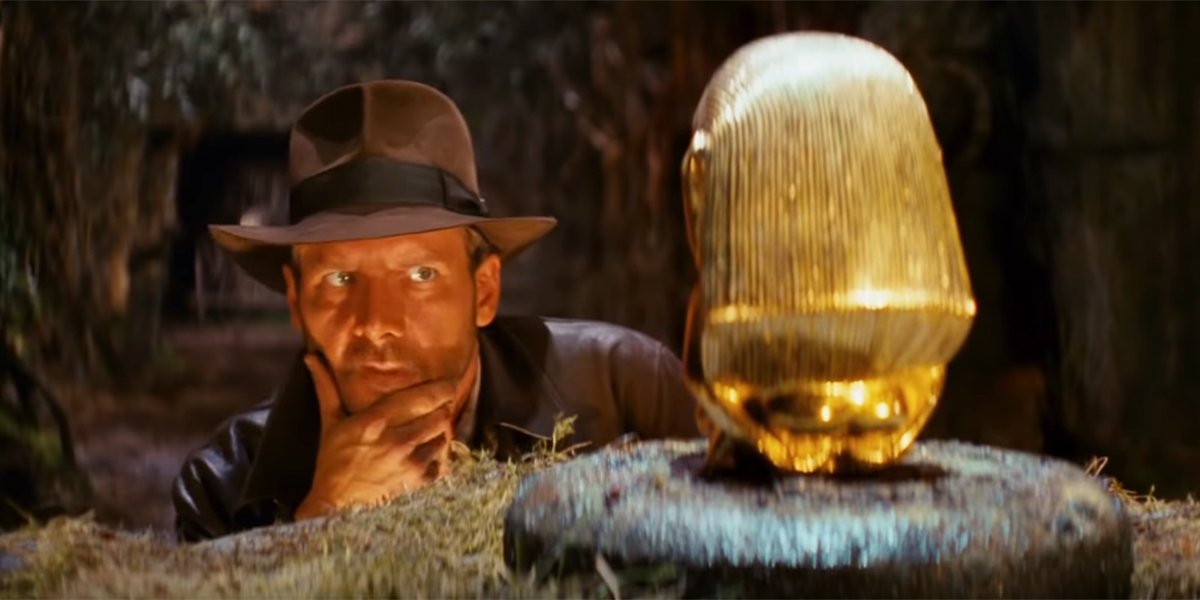 Indiana Jones musing over the Golden Idol in Raiders of the Lost Ark