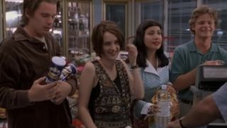 From left to right, Ethan Hawke, Winona Ryder, Janeane Garofalo, and Steve Zahn smile at a convenience store in Reality Bites