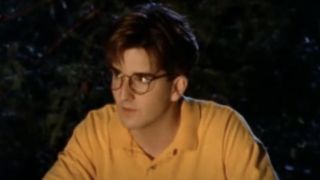 Ross Hull as Gary sitting in front of the fire with the Midnight Society on Are You Afraid of the Dark?