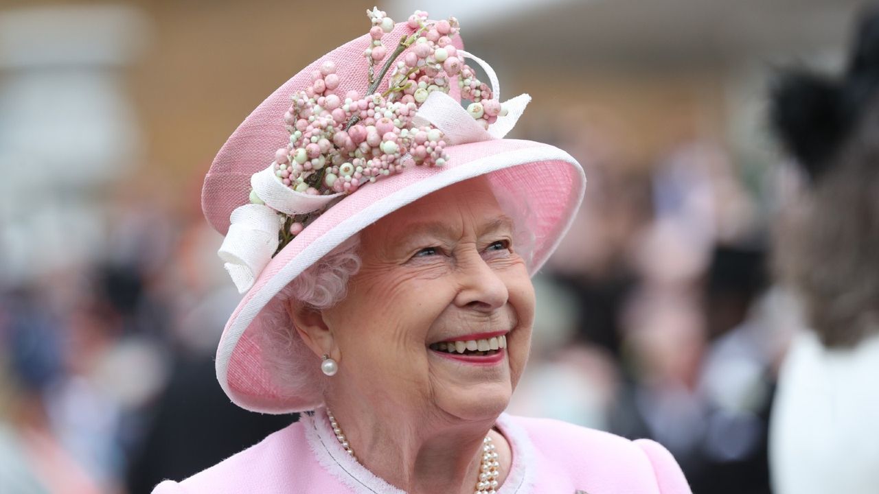 LONDON, ENGLAND - MAY 29: Queen Elizabeth II meets guests as she attends the Royal Garden Party at Buckingham Palace on May 29, 2019 in London, England.