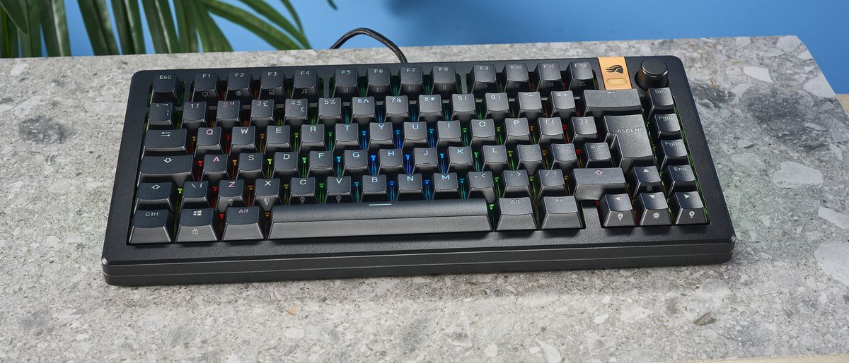 The Glorious GMMK 3 HE keyboard in black on a stone surface