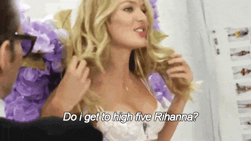 Candice Swanepoel plays with her hair while saying, "Do I get to high five Rihanna?"