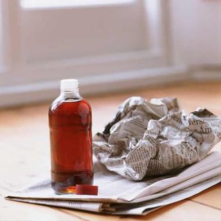 paper and vinegar bottle