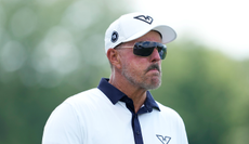 Phil Mickelson walks off the green