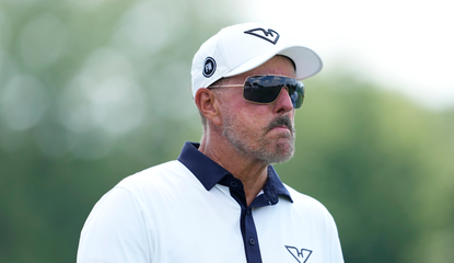 Phil Mickelson walks off the green