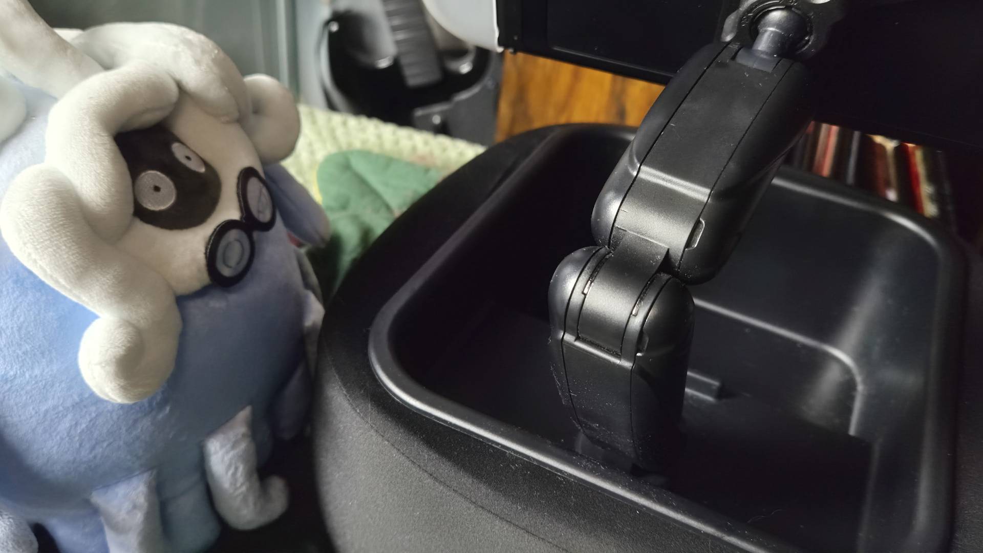 Photo of a plush of Professor Tangrowth from Pokemon Pokopia sitting next to the Lululook Switch 2 Gaming Pillow.