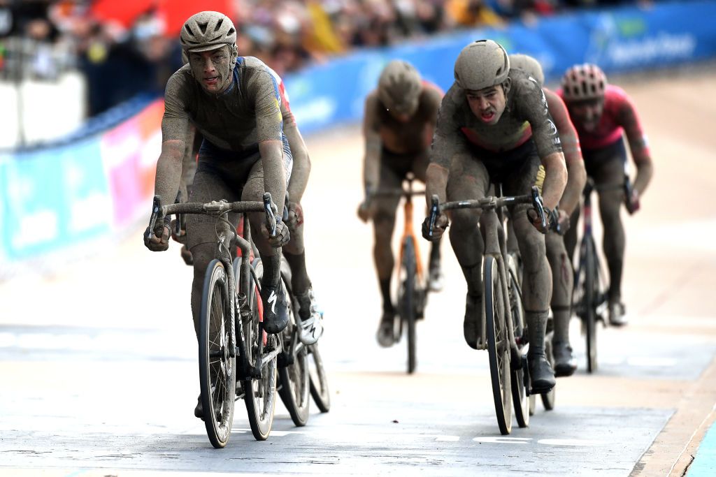 ROUBAIX FRANCE OCTOBER 03 Yves Lampaert of Belgium and Team Deceuninck QuickStep and Wout Van Aert of Belgium and Team Jumbo Visma cross the finishing line in the Roubaix Velodrome Vlodrome Andr Ptrieux during the 118th ParisRoubaix 2021 Mens Eilte a 2577km race from Compigne to Roubaix ParisRoubaix on October 03 2021 in Roubaix France Photo by Tim de WaeleGetty Images