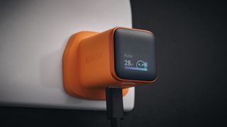 Anker Nano 45W Smart Display Charger plugged in with display on