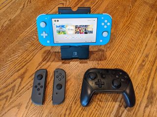 Turquoise Nintendo Switch Lite with Joy-Cons and Pro Controller