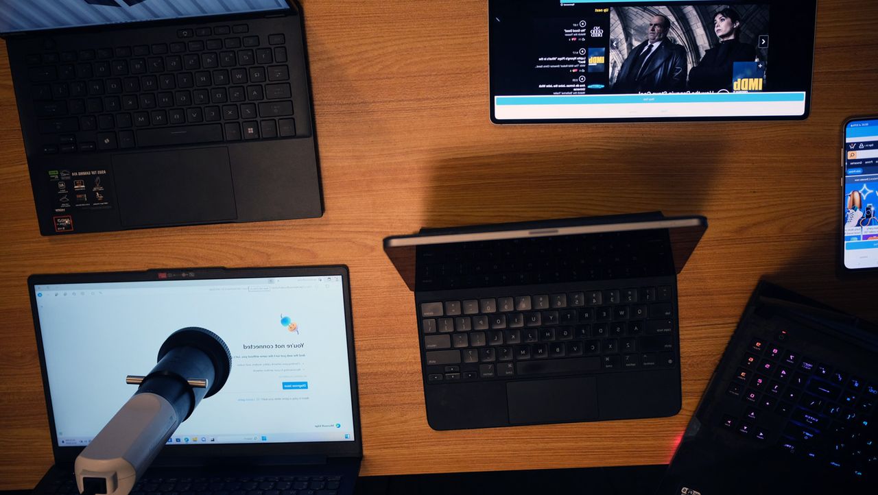 Laptop Mag testing lab, highlighting four laptops, one tablet, and one smartphone taking a variety tests.