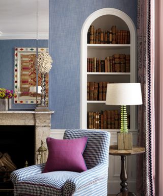 Blue living room with arches bookshelf