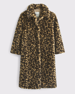 a leopard print faux fur coat from abercrombie in fitch in front of a plain backdrop