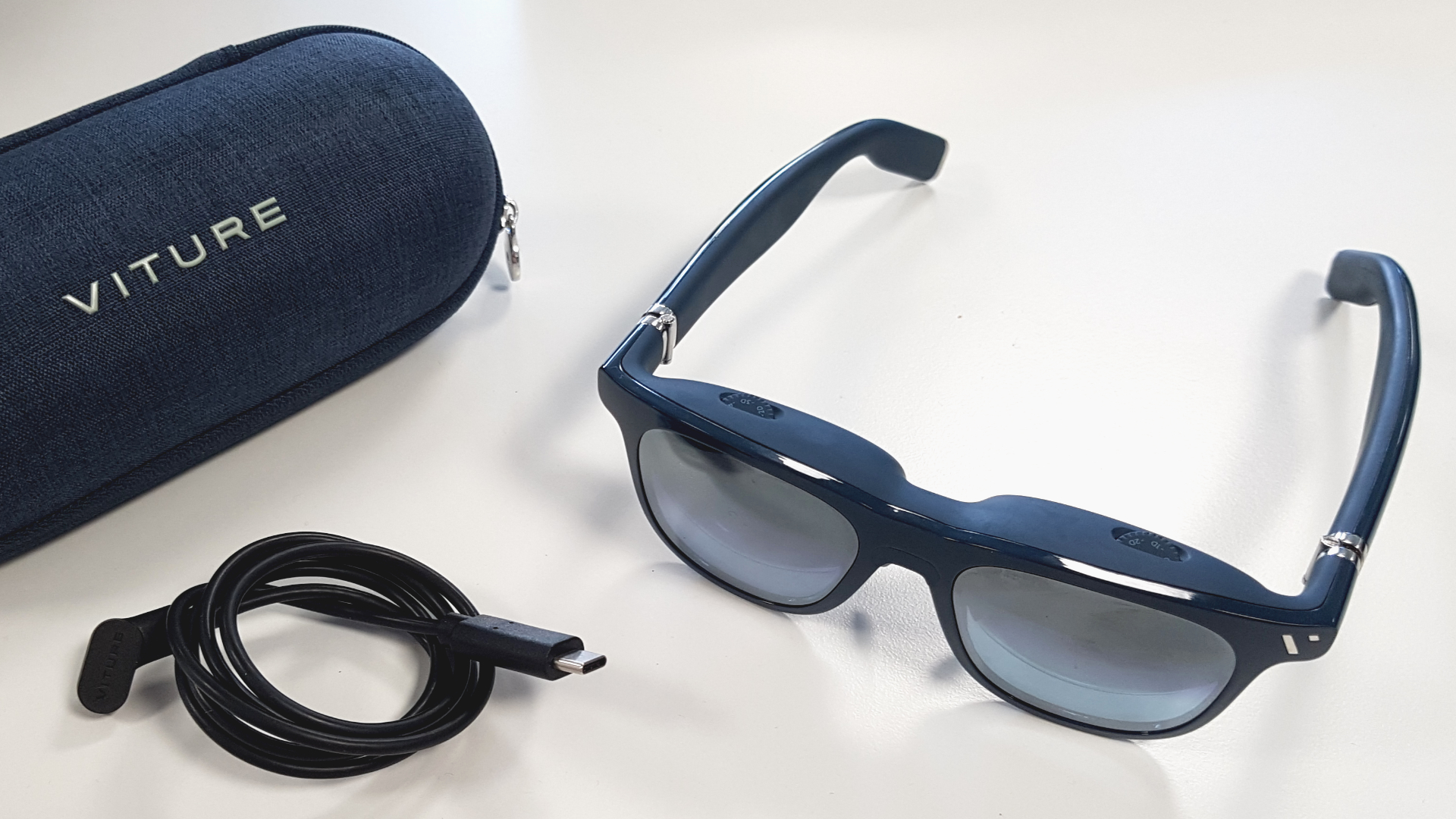 Viture One XR glasses close with case and cable.