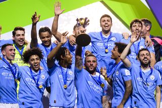 Manchester City players celebrate their Club World Cup final win over Fluminense in December 2023.