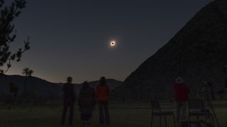 People watch the total solar eclipse from El Molle, Chile, on July 2, 2019. - Tens of thousands of tourists braced Tuesday for a rare total solar eclipse that was expected to turn day into night along a large swath of Latin America's southern cone, including much of Chile and Argentina. 