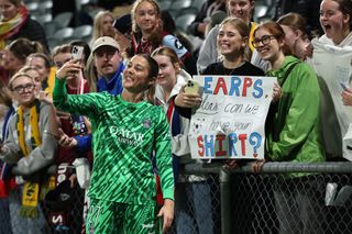 Mary Earps of Paris Saint-Germain takes a selfie for spectators following the Perth International Football Cup match between West Ham United and Paris Saint-Germain at HBF Park on August 29, 2024 in Perth, Australia.