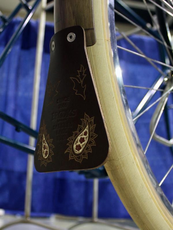 The leather fender flaps on the Banjo Cycles tourer were sourced from Brooks but custom decorated by Kara Ginther Leather.