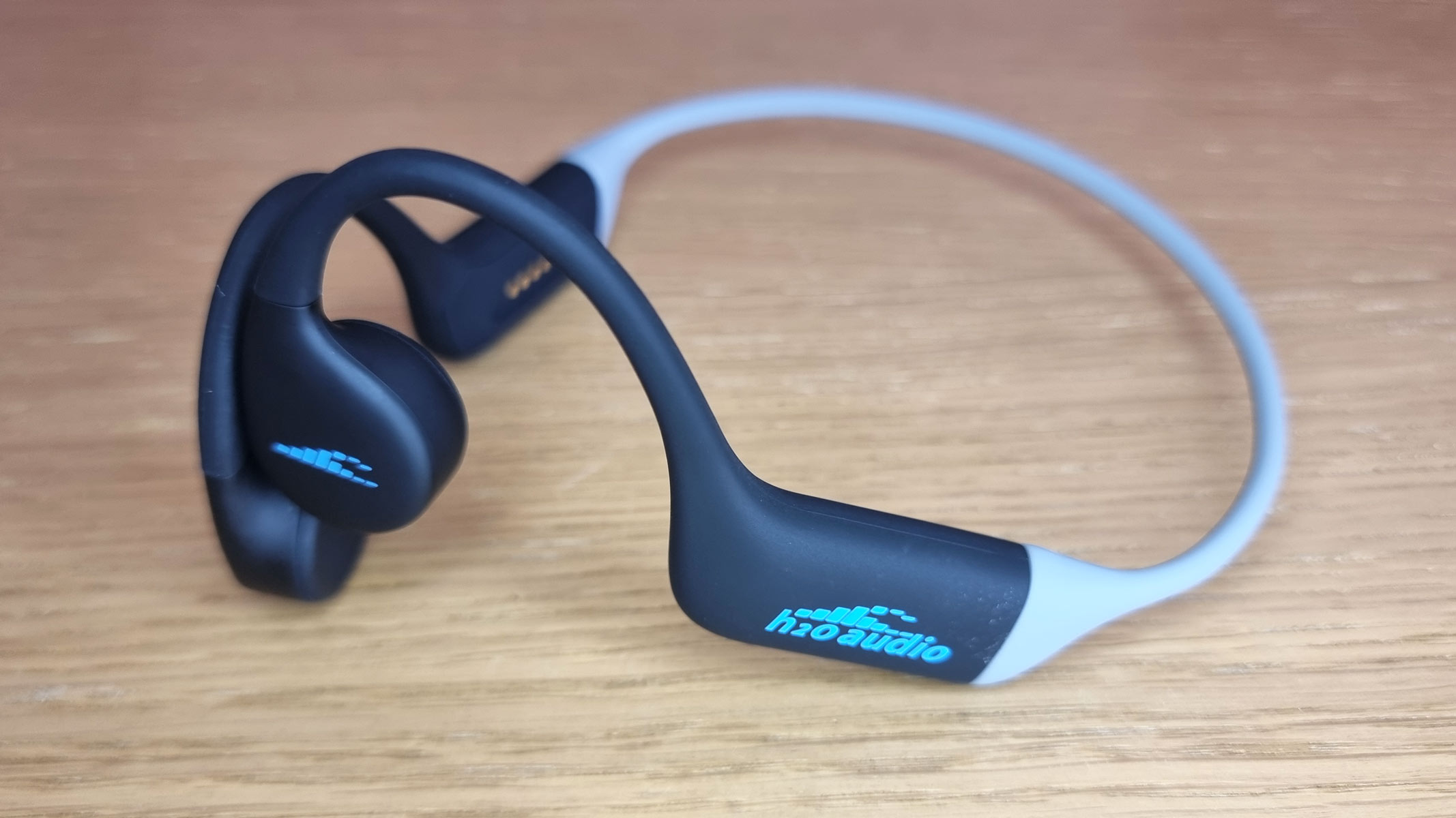 a close-up picture of the H20 Audio Tri Run headphones, a view from the side