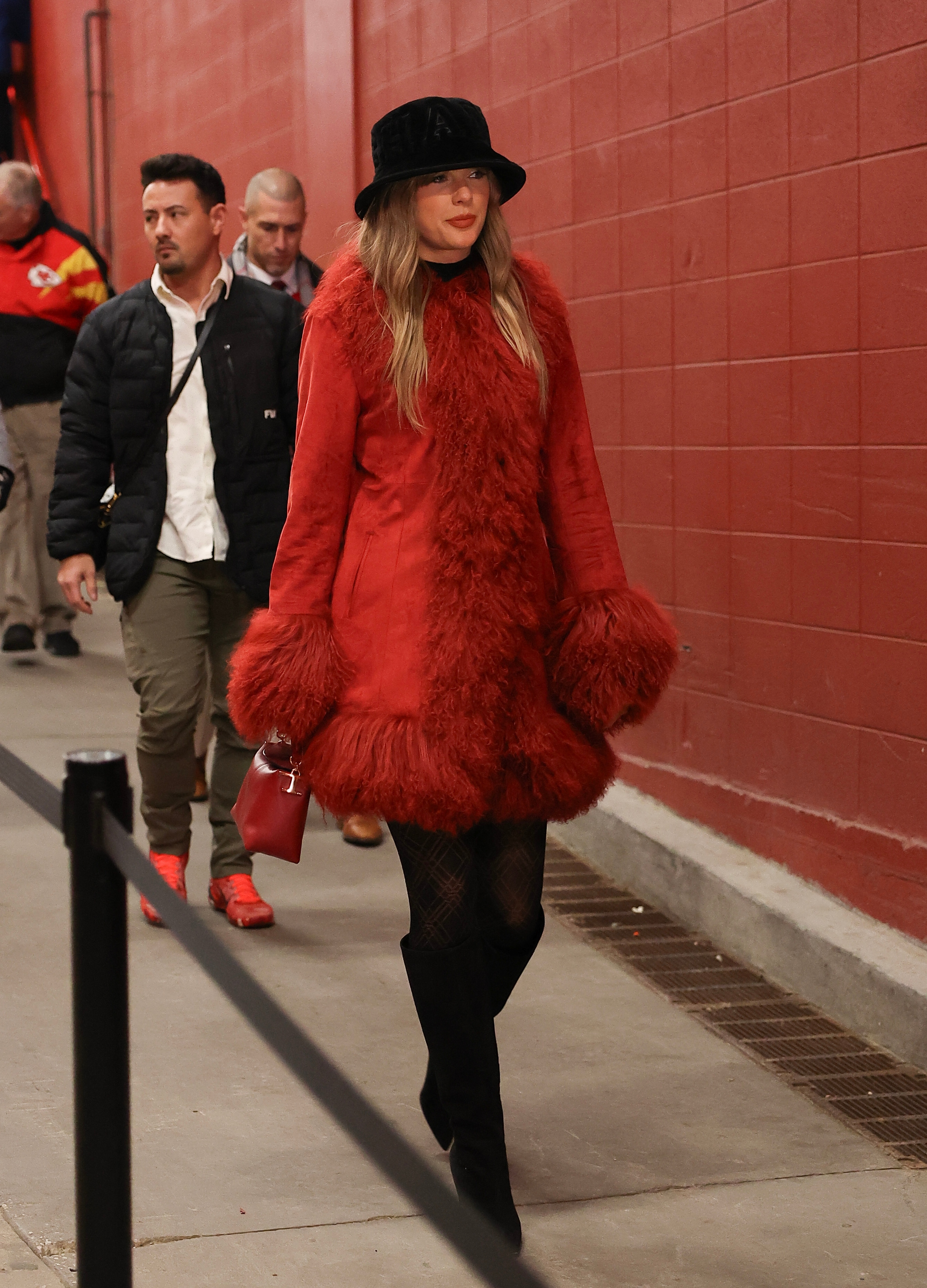 Taylor Swift wearing red coat