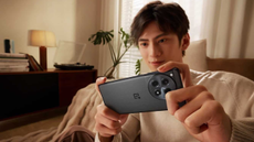 man holding the oneplus 12R