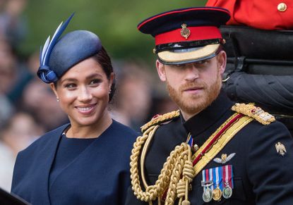 Prince Harry, Duke of Sussex and Meghan, Duchess of Sussex ride by carriage down the Mall during Trooping The Colour, the Queen's annual birthday parade, on June 08, 2019 in London, England.