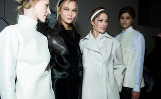 Female models wearing white and black jackets from the Fendi A/W 2015 collection