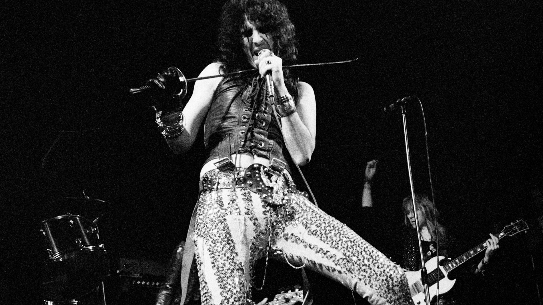 Black and white image of Alice Cooper and Glen Buxton onstage in 1972
