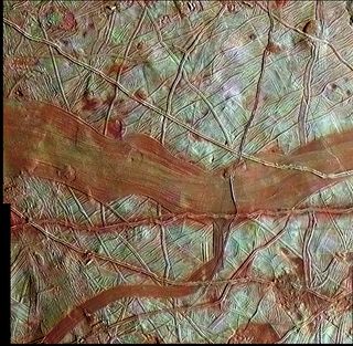 Reddish bands on Europa indicate regions of ice mixed with hydrated salts, while the blue-white terrain is relatively pure water-ice.